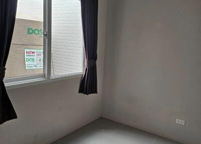 Minimalist empty bedroom with window and tiled floor