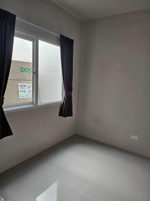 Minimalist empty bedroom with window and tiled floor