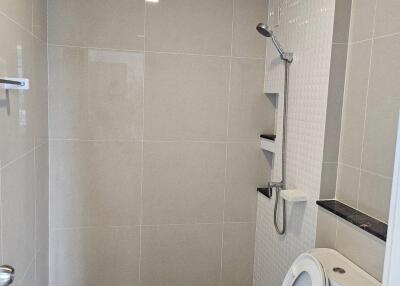 Modern bathroom with shower area and toilet