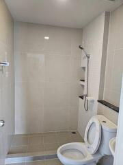 Modern bathroom with shower area and toilet