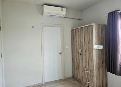 Bedroom with wardrobe and air conditioner