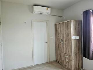 Bedroom with wardrobe and air conditioner