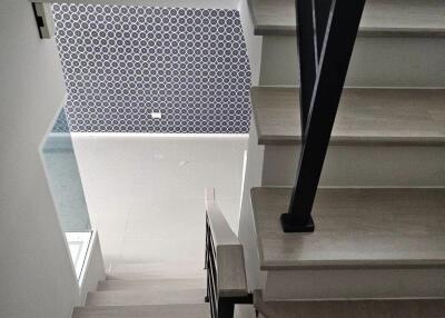 Modern staircase with decorative wall pattern