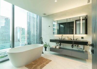 Modern bathroom with city view, freestanding tub, dual sink vanity and large mirror