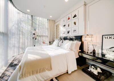 Modern and bright bedroom with large windows