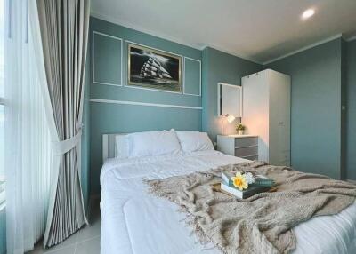 Cozy bedroom with light blue walls and modern decor