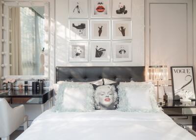 Stylish bedroom with modern decor and artwork