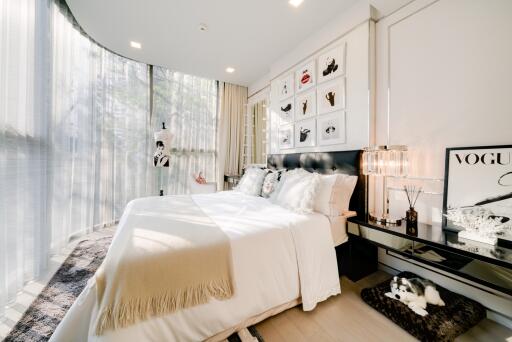 Modern bedroom with large windows and elegant decor