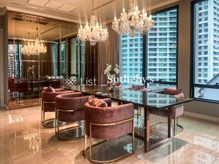 Elegant dining area with chandelier lighting and city view