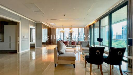 Spacious and luxurious living room with modern furniture and city view