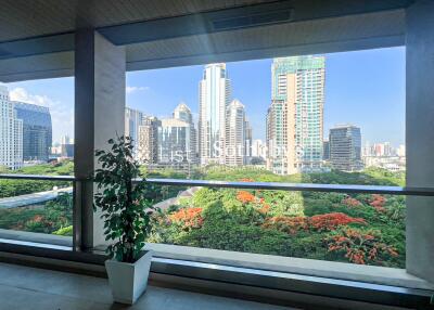 Balcony with city skyline and green view