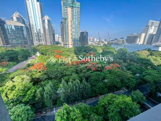 View of the cityscape with high-rise buildings and green park