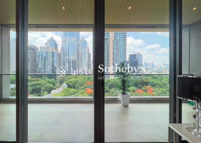 Living area with a large window offering a cityscape view