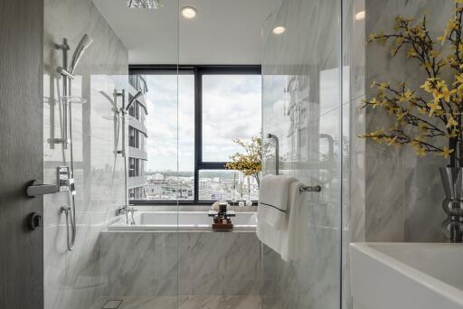 Modern bathroom with large window view and contemporary fixtures