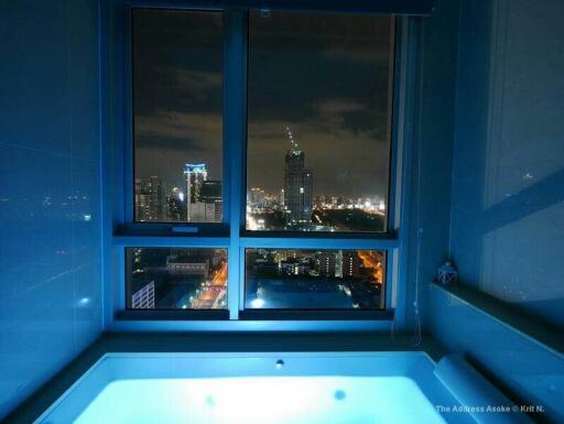 Night city view from bathroom window