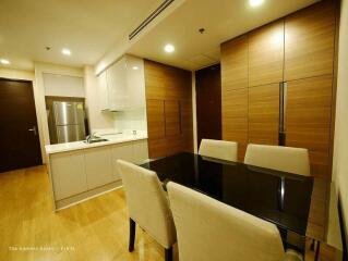 Modern kitchen and dining area with wood and glass finish