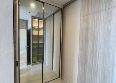 Spacious closet with mirror doors