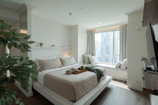 Bright and modern bedroom with a city view