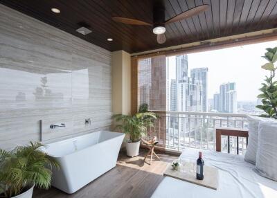 Luxurious bathroom with a freestanding bathtub and city view