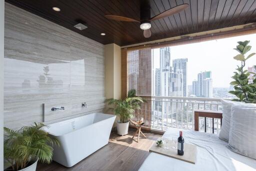 Luxurious bathroom with a freestanding bathtub and city view