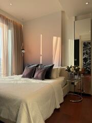 Cozy bedroom with modern decor and sunlight streaming in