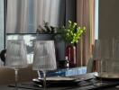 Modern dining area setup with glassware and plants