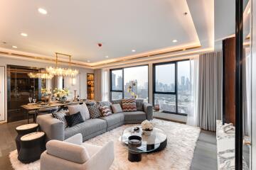 Modern living and dining area with city view windows