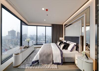 Modern bedroom with large windows and city view