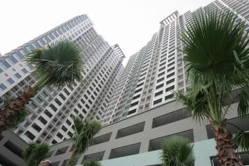 High-rise residential buildings with palm trees