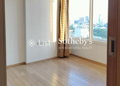 Bedroom with wooden floor and city view