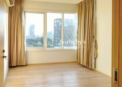 Spacious bedroom with floor-to-ceiling windows