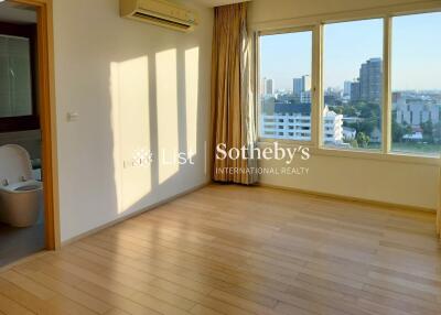 Main living area with large windows and city view