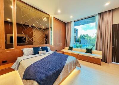 Modern bedroom with large window and stylish decor