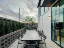 Outdoor dining area with a large table and chairs