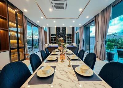 Elegant dining room with large windows and modern decor