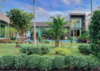 Modern building with a green front yard