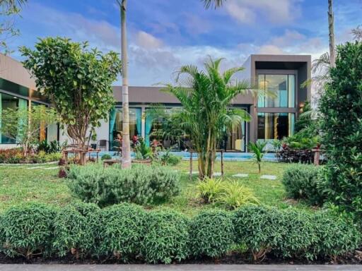 Modern building with a green front yard