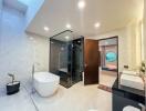 Modern bathroom with glass shower and freestanding bathtub