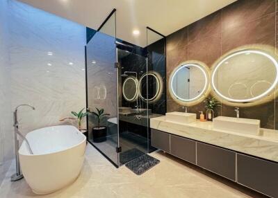 Luxurious modern bathroom with standalone tub and double vanity