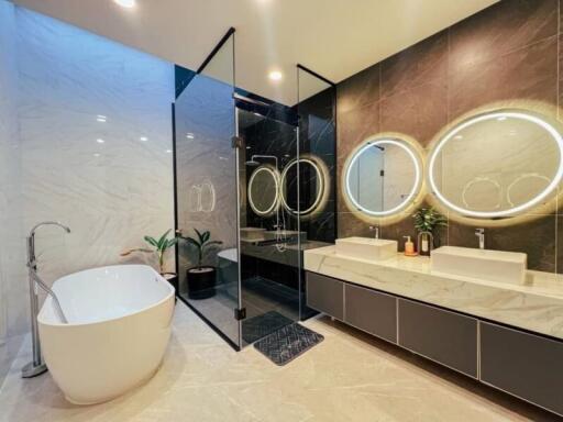 Luxurious modern bathroom with standalone tub and double vanity