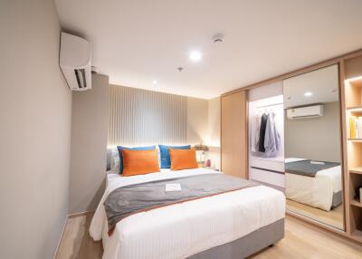 Modern bedroom with double bed and wardrobe