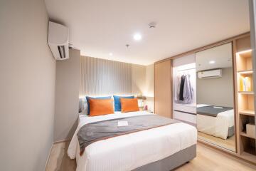 Modern bedroom with double bed and wardrobe