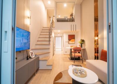 Modern living room with staircase and loft