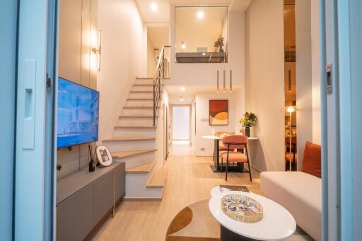 Modern living room with staircase and loft