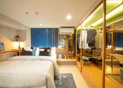 Modern bedroom with mirrored wardrobe and stylish decor