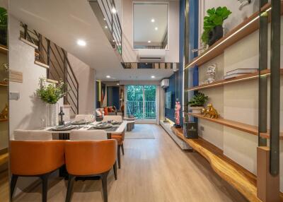 Modern living room with dining area and balcony access