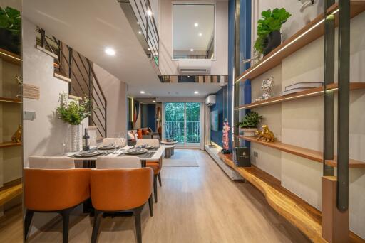 Modern living room with dining area and balcony access