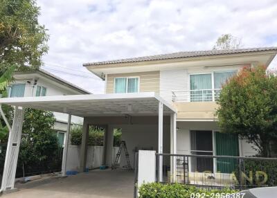 Two-story house with carport