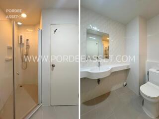 Modern bathroom with shower, sink, and toilet