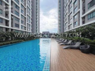 Outdoor swimming pool between tall residential buildings